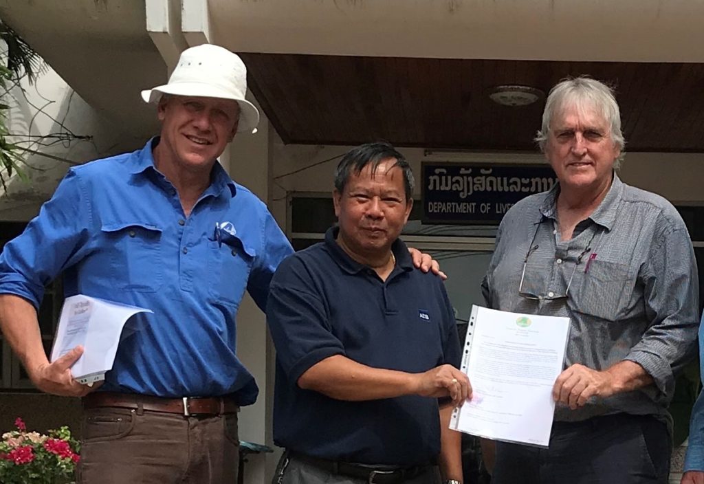 BPP partners Mr Chick Olsson, Dr Syseng Khounsy and Prof Peter Windsor display the revised MOU